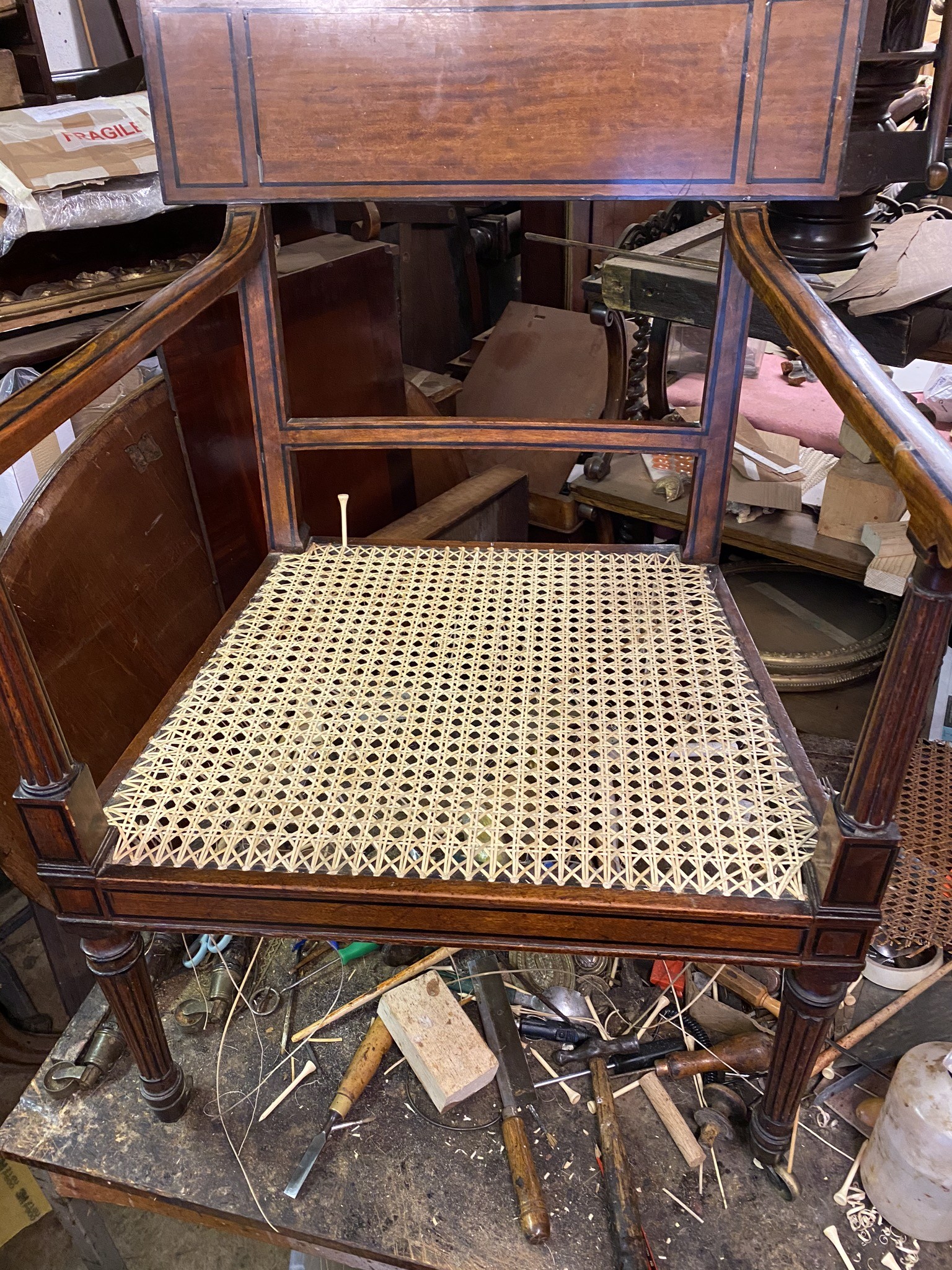 recaning the seat of an important solid satinwood ebony inlaid armchair attributed to thomas chippendale the younger