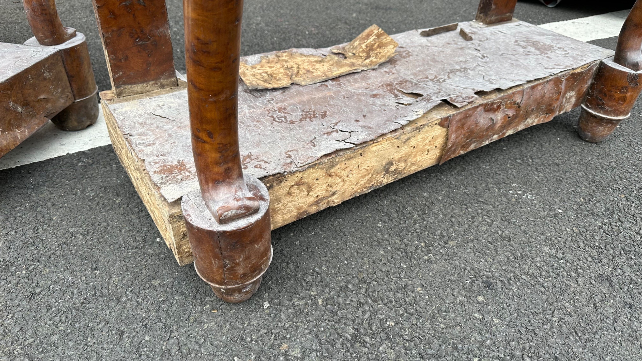 these fine pair of early 19th c burr elm console tables had suffered extensive damage after a flood