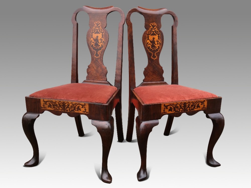a superb pair of irish early 18th c walnut and marquetry side chairs