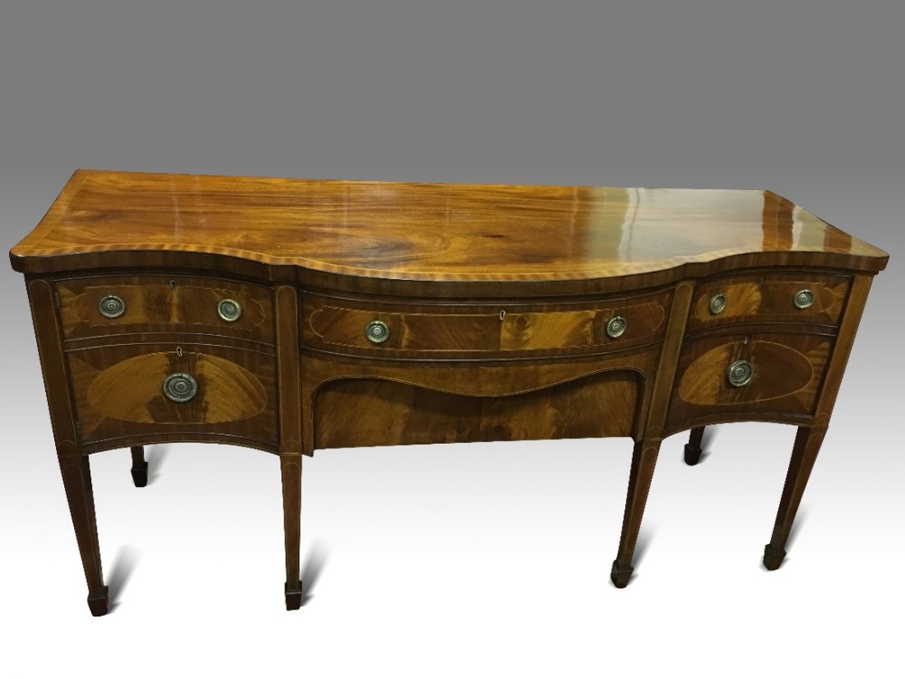 a superb george iii sheraton style serpentine mahogany and inlaid sideboard