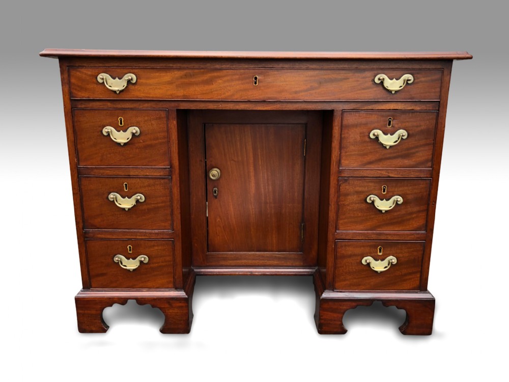 a mid 18th century mahogany kneehole desk