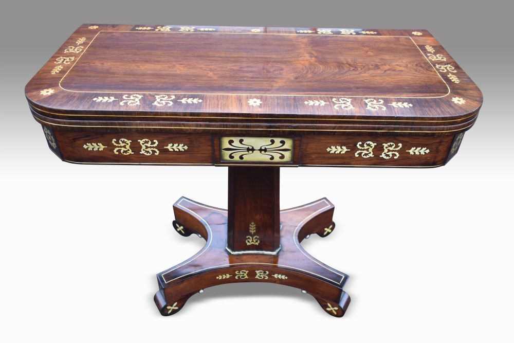 a superb regency rosewood brass inlaid card table
