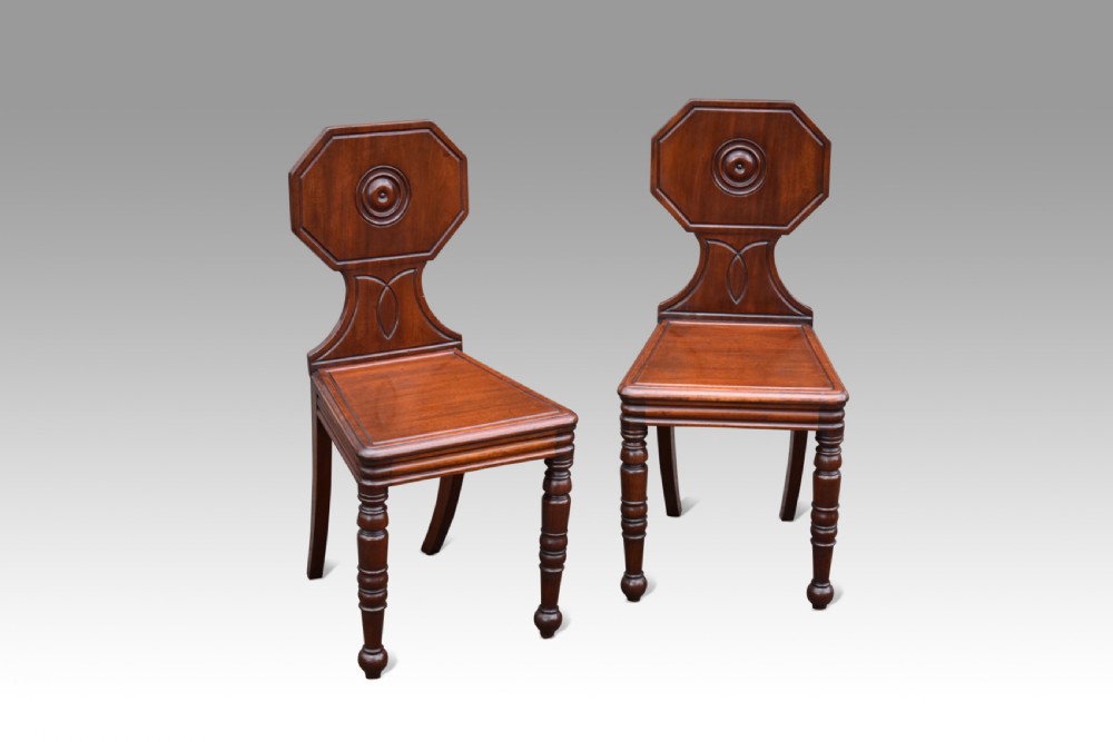 pair of regency mahogany hall chairs