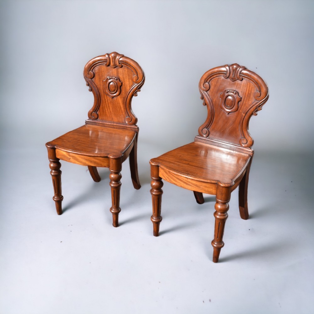 a pair of william iv mahogany hall chairs