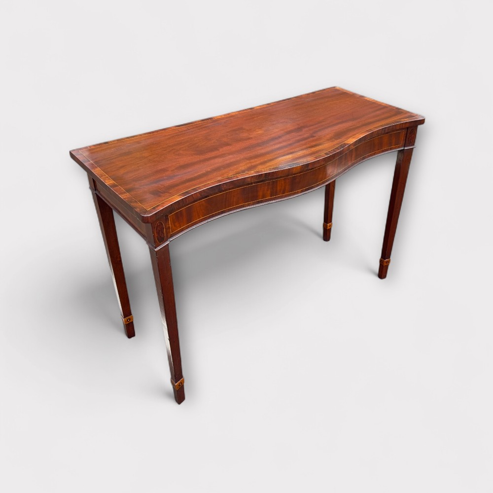 a fine george iii irish mahogany inlaid serpentine console table