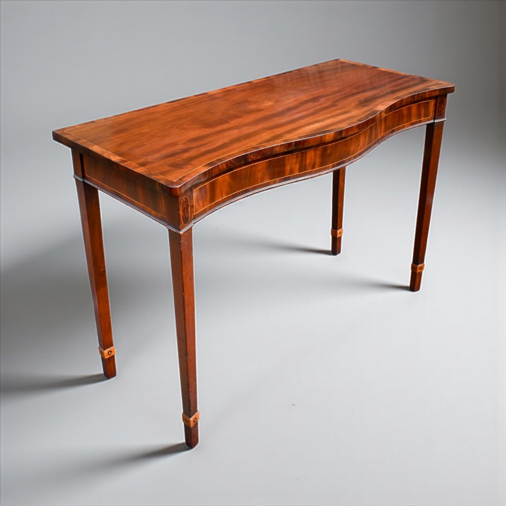 a fine george iii irish mahogany inlaid serpentine console table